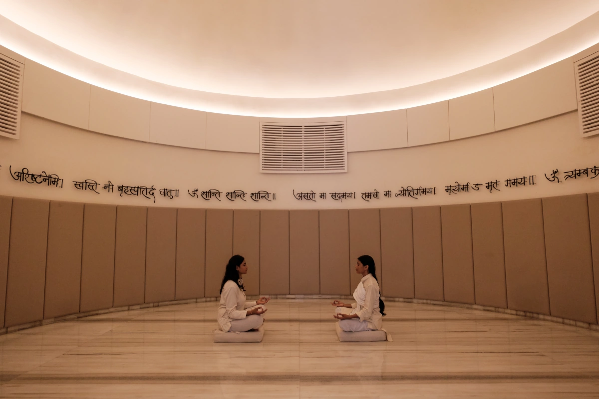 Stay in a stylish boutique wellness resort surrounded by nature, offering Ayurvedic spa and peaceful atmosphere during a women’s only trip to India