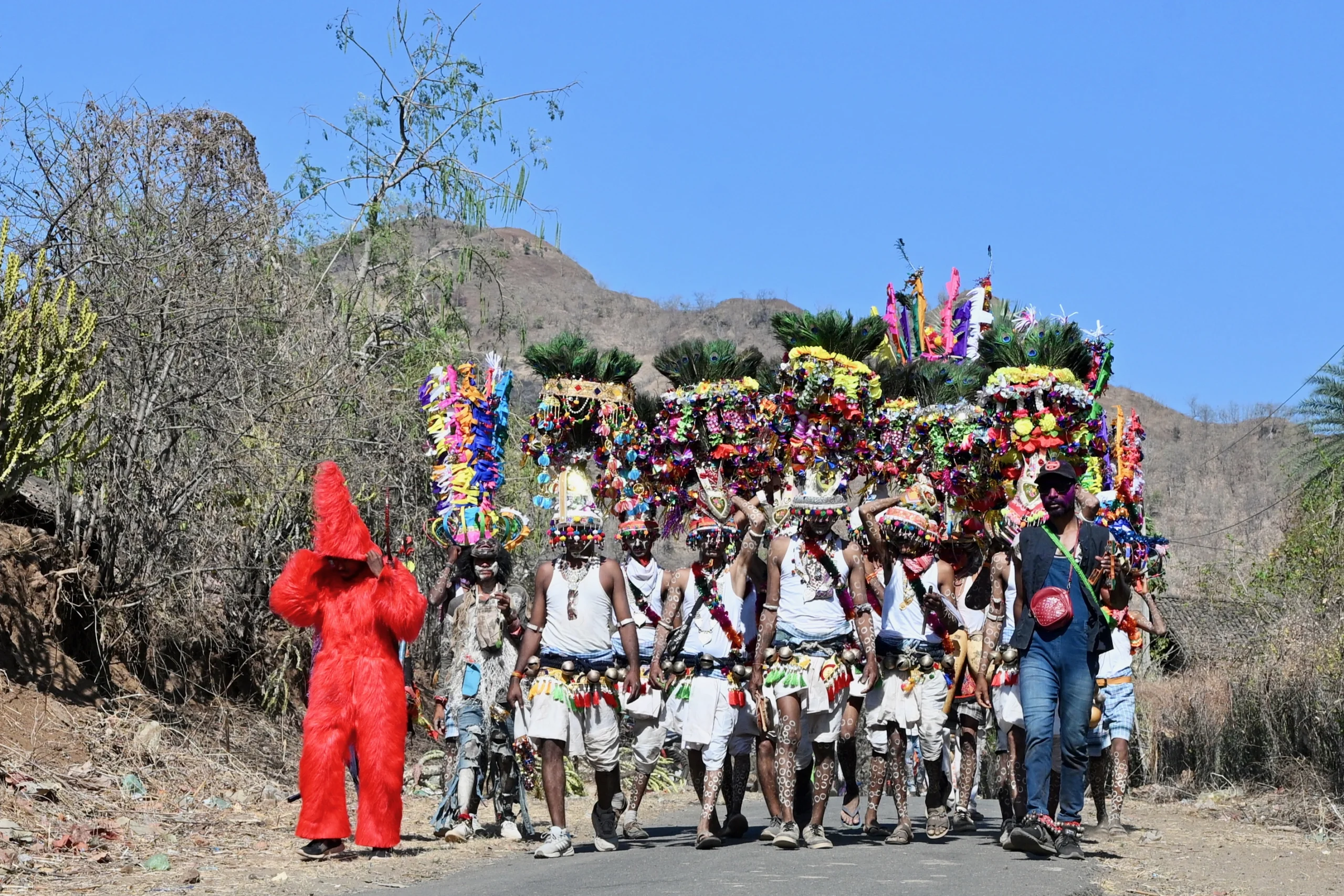 Rathwa tribesmen dancing in traditional attire during the Kavant Festival in Madhya Pradesh, during a photo tour in India.